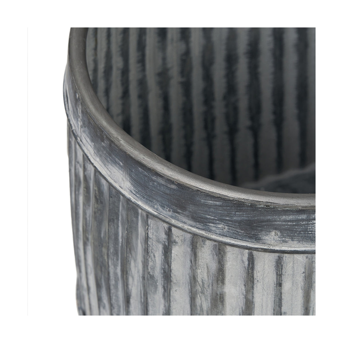 Close-up of a galvanised zinc oval planter from a set of 3, showing the ribbed metal texture and rolled rim in weathered grey finish.