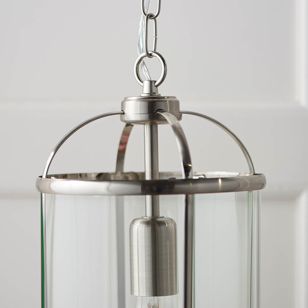 Close-up of the Endon Caldbury pendant light in nickel, showing the top ring, chain suspension, E27 lamp holder and clear glass panels.