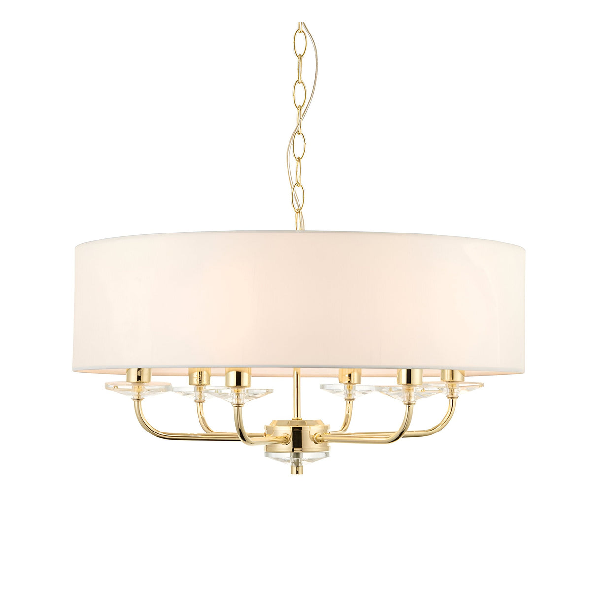Endon Castdon 6 light pendant in brass with a large white faux silk drum shade, crystal bobeche details, and chain suspension on a white background.