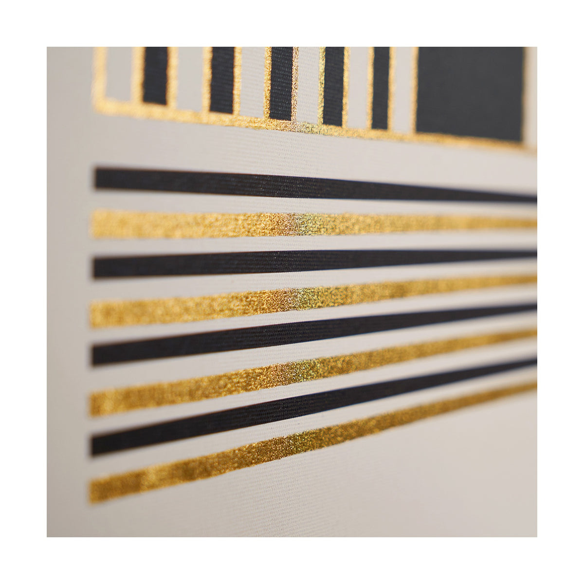Close-up of an Art Deco canvas print, 60 x 80cm, showing black and gold linear stripe detail with a black geometric panel, set against a light background.
