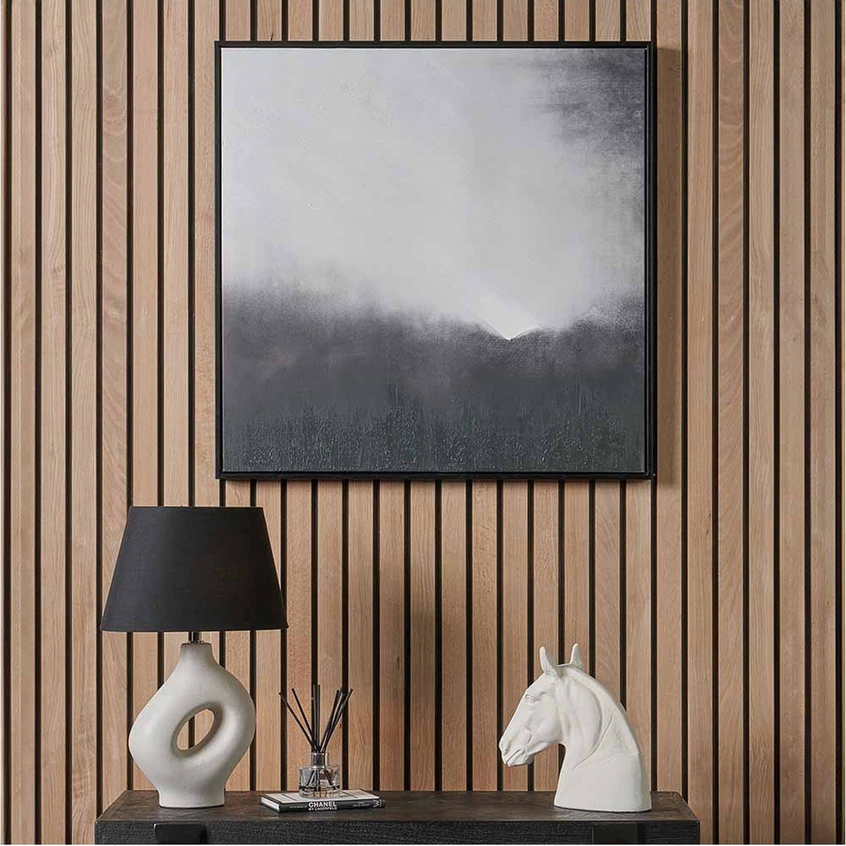Monochrome Abstract Square Canvas with black frame, 80 x 80cm, hung on a wood-panelled wall above a dark console table with lamp and horse-head ornament.