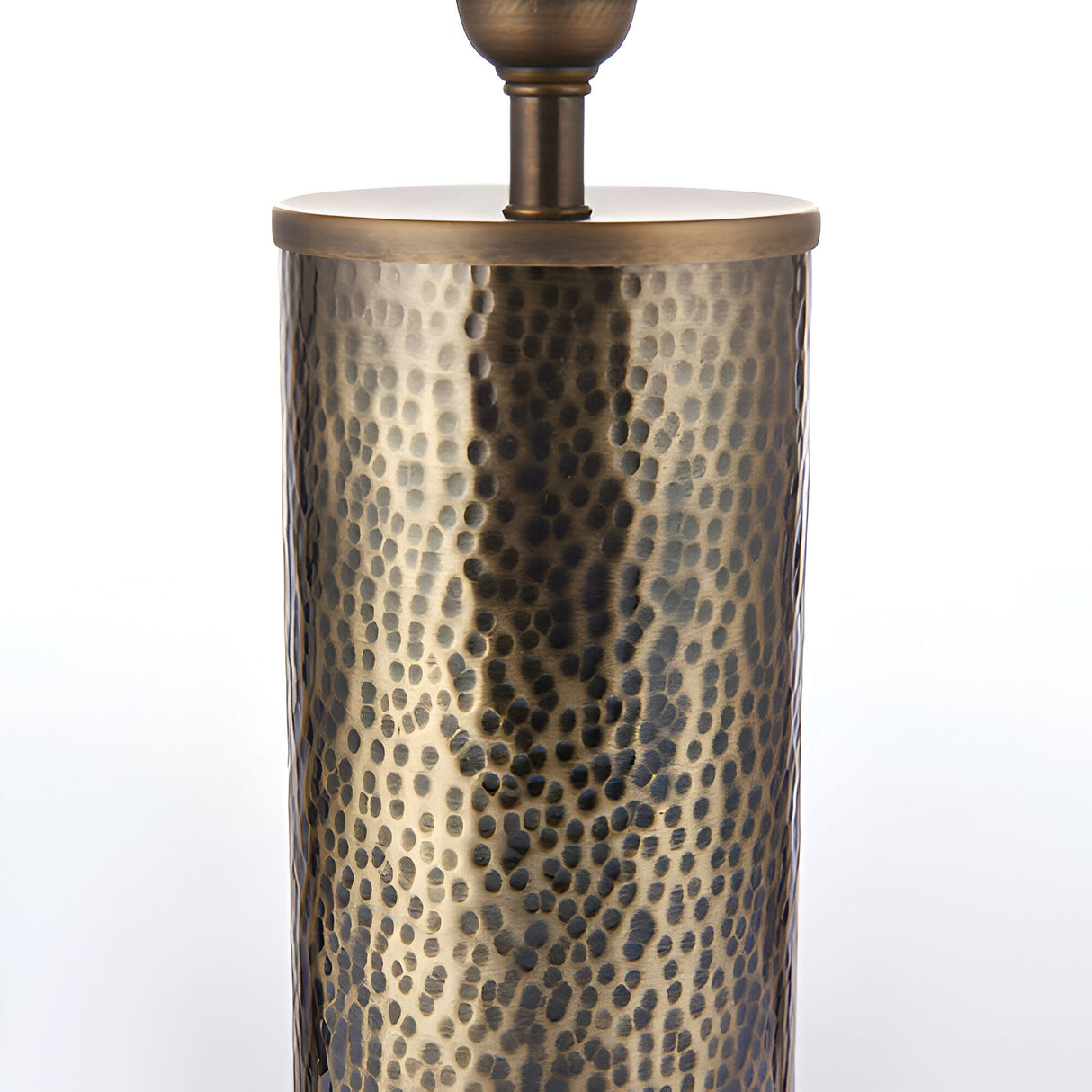 Close-up of the Endon Brenwood table lamp base, showing its hammered aged bronze steel cylinder and brass fitting against a plain white background.