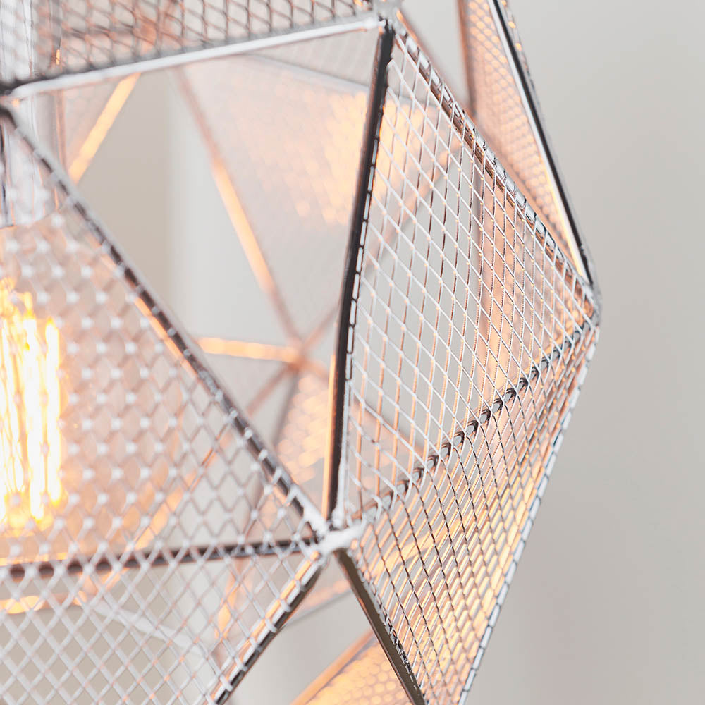Close-up of the Aldford Pendant in polished chrome, showing its geometric mesh triangle shade and lit E27 bulb against a plain background.