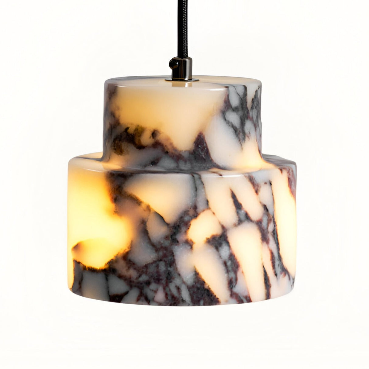 The Valmere 1 Light Veined Marble Single Pendant Light in White & Black features a cylindrical marble-look shade with striking dark veining and emits a warm yellow glow for a soft, elegant effect.