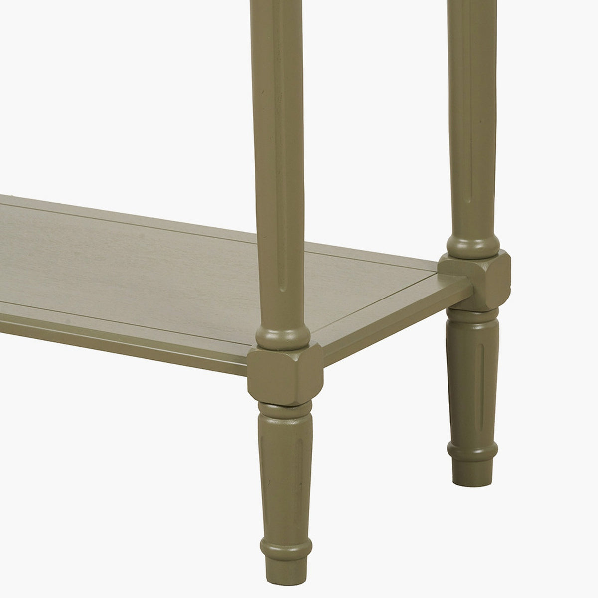 Close-up of the Heritage Olive Pine Console Table's turned wooden legs and lower shelf, finished in olive green with carved detailing, on a plain white background.