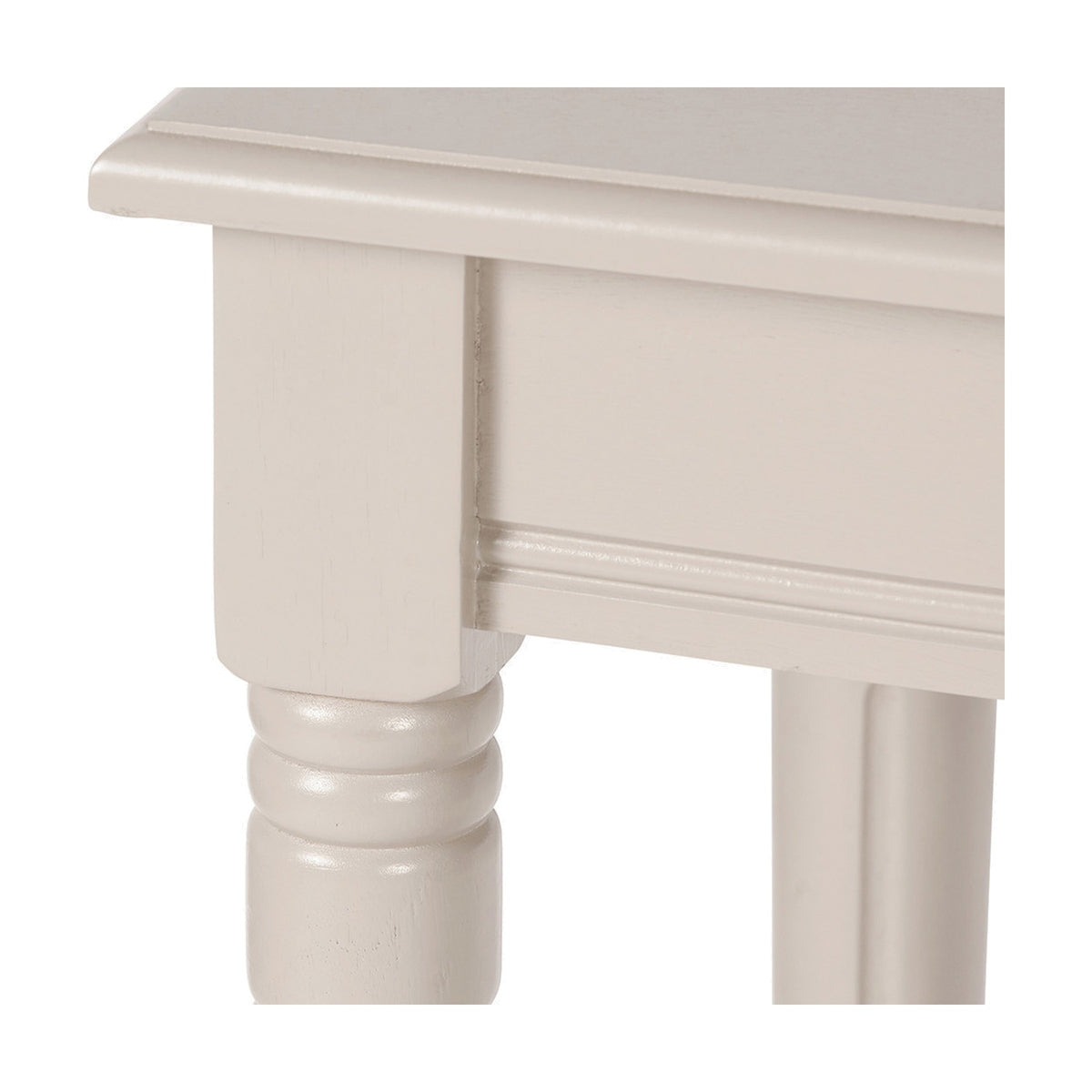Close-up of the Heritage Putty Pine Console Table's turned wooden leg and shaped apron, showing the cream finish and moulded edge detailing on a white background.