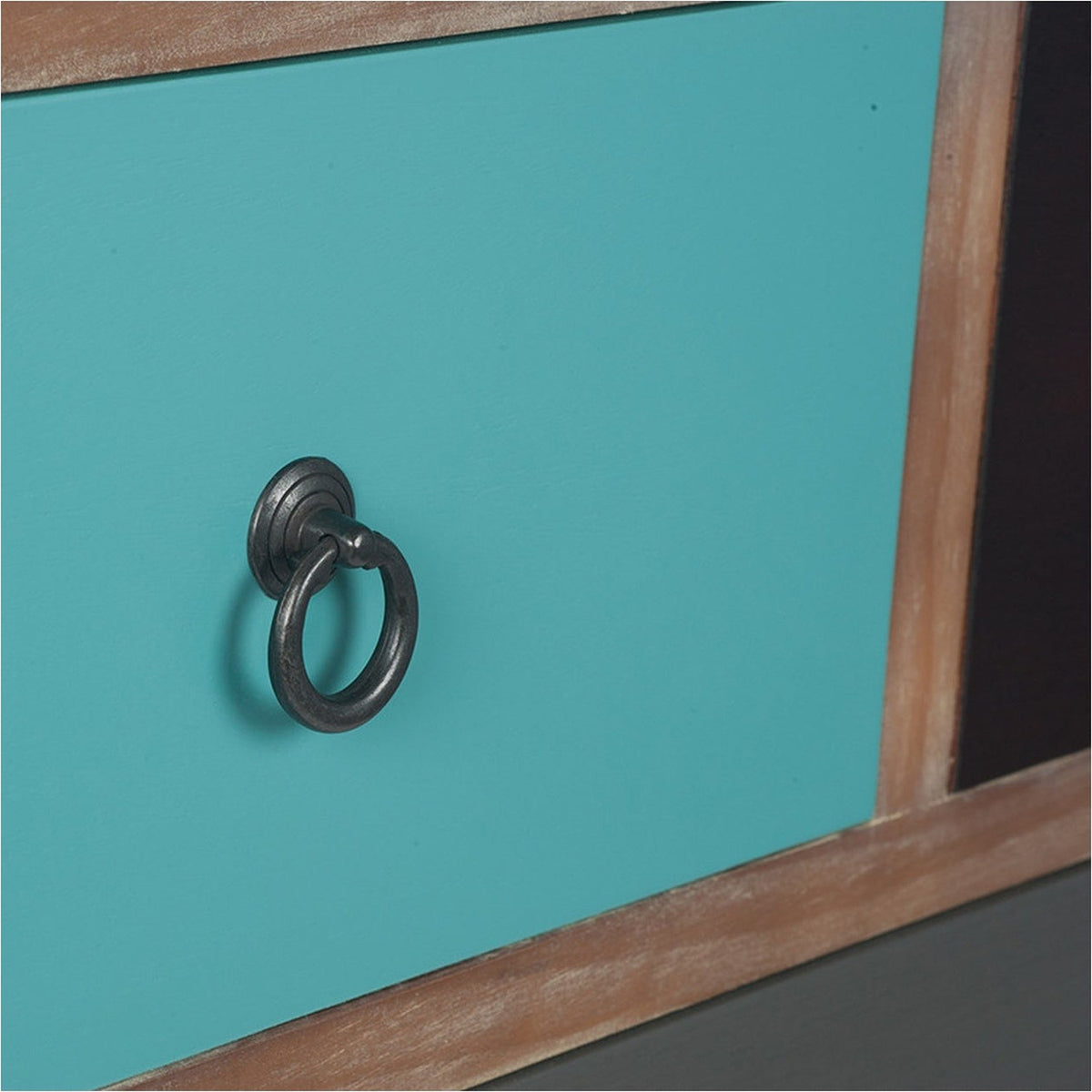 Close-up of the Loft Blue chest of drawers showing a teal drawer front with dark metal ring pull and natural wood frame edging.