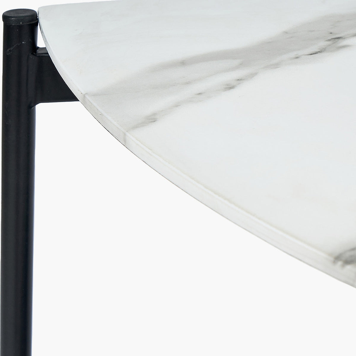 Close-up of the Marchello console table's white marble veneer top edge with subtle grey veining, supported by a matte black iron frame and leg.