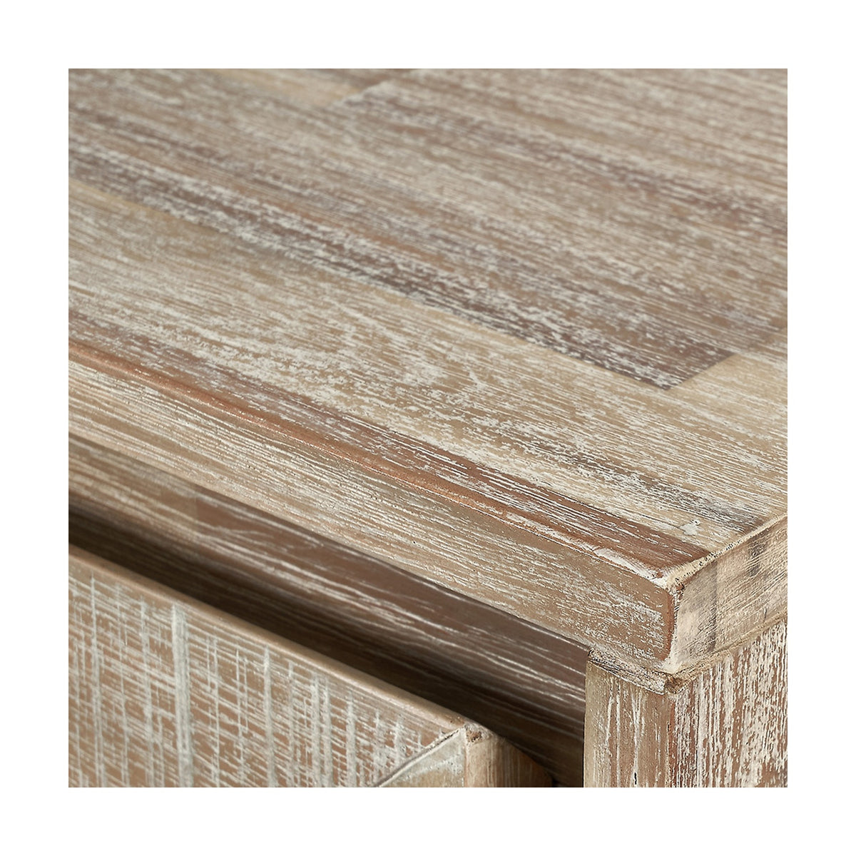 Close-up of the Marca Bar Cabinet's top corner, showing sand wash acacia wood grain with a whitewashed finish and mitred edge detailing.