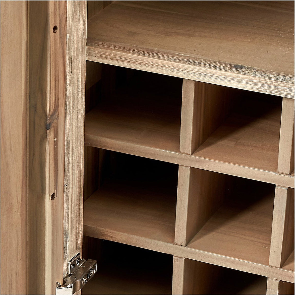 Close-up of the Marca sand wash acacia bar cabinet's open door, showing wood-grain interior with square storage cubbies and a visible metal hinge.
