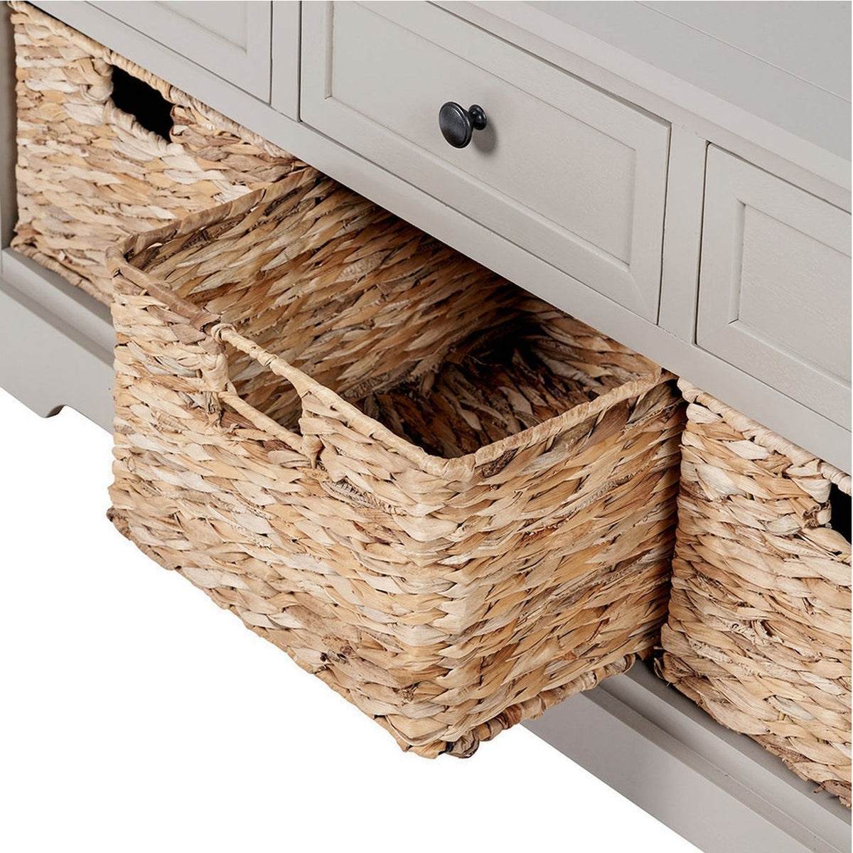 Close-up of the Devonshire Putty Pine 3 Drawer Basket Unit Sideboard, showing a woven wicker storage basket pulled out beneath painted grey drawers with black knobs.