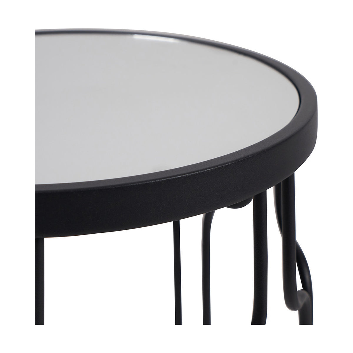 Close-up of the Caprisse side table's round mirrored glass top and graphite iron rim, showing the curved metal legs beneath on a white background.