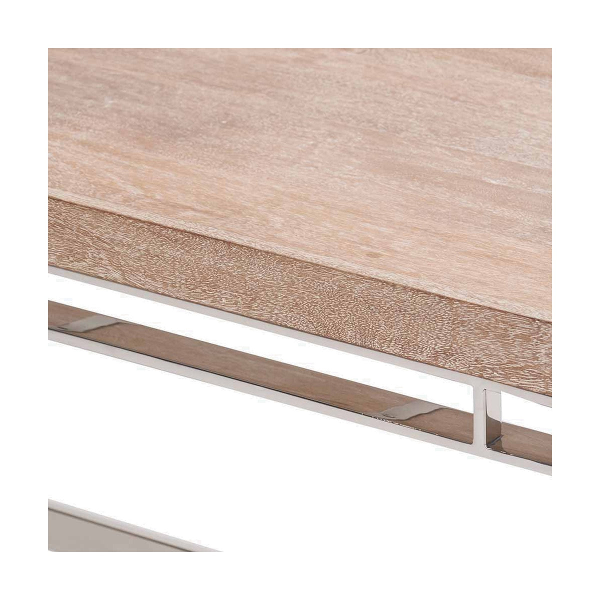 Close-up of the Evelyn coffee table showing the natural mango wood tabletop edge and grain above a silver metal frame, on a plain white background.
