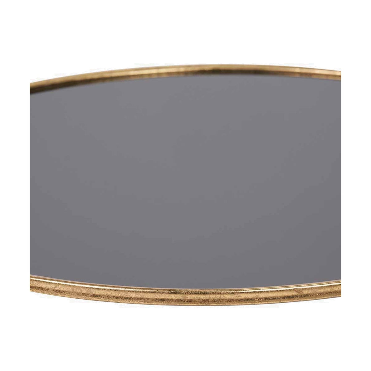Close-up of the Veneziano coffee table's round black glass top and antique gold iron rim, showing the brushed metallic edge detail.