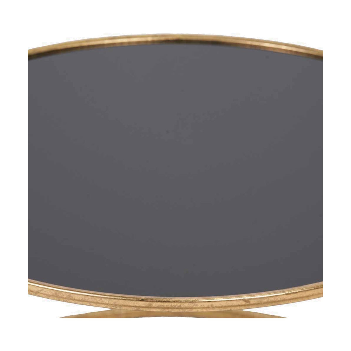 Close-up of the Veneziano coffee table's round black glass top with antique gold iron rim, showing the curved edge and part of the base.