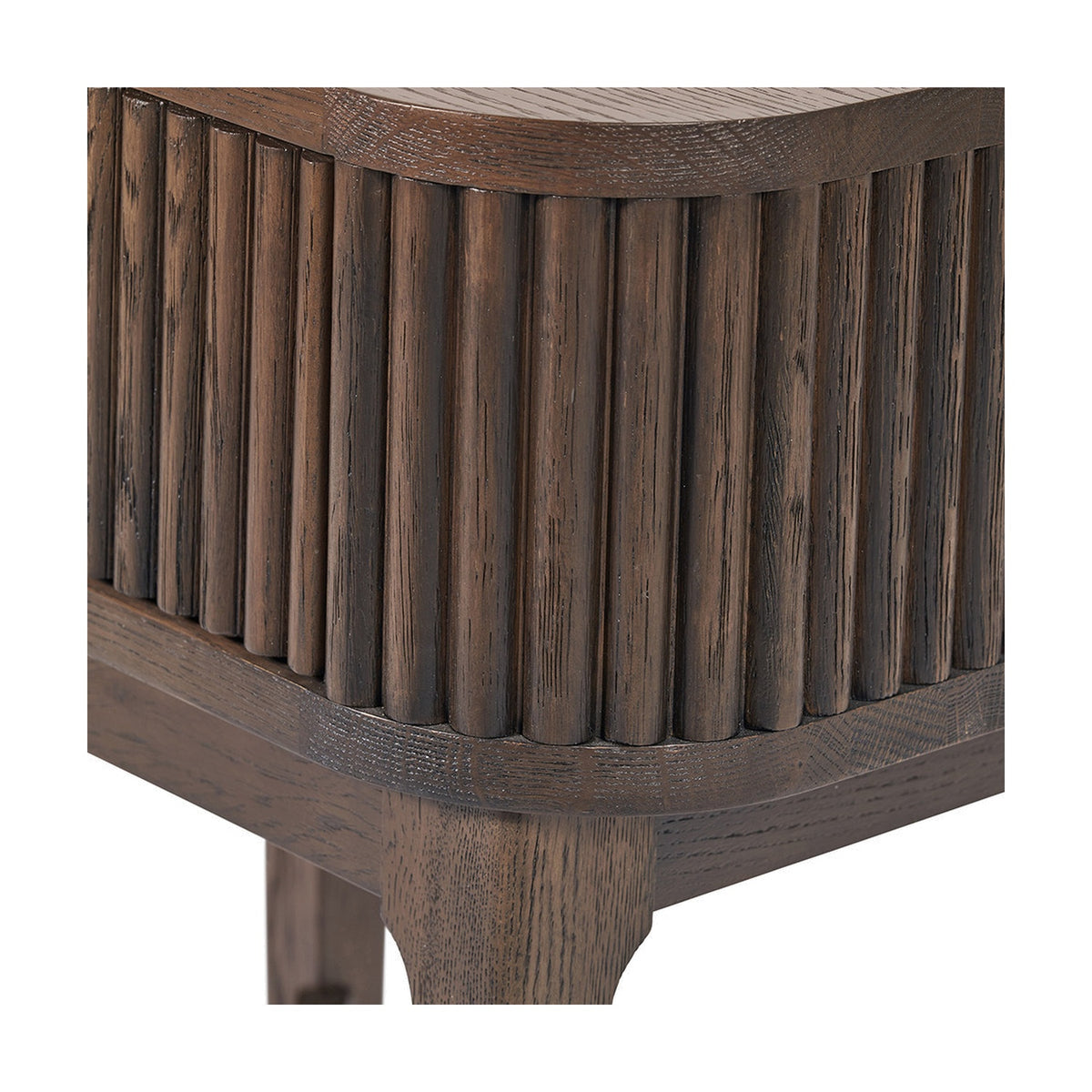 Close-up of the Raie Dark Brown Ribbed Oak & Pine 1 Drawer Unit, showing vertical fluted oak panelling, curved top corner, and tapered wooden leg detail.