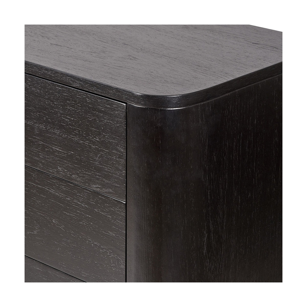 Close-up of the Ukiah Black Ash Veneer chest of drawers, showing a rounded top corner, drawer fronts, and wood-grain finish in black.