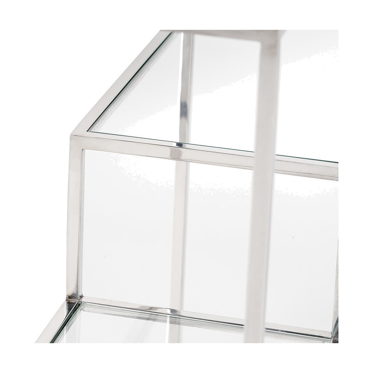 Close-up of the Aleandra Console Table's corner joinery, showing clear glass shelving framed by polished chrome metal against a white background.