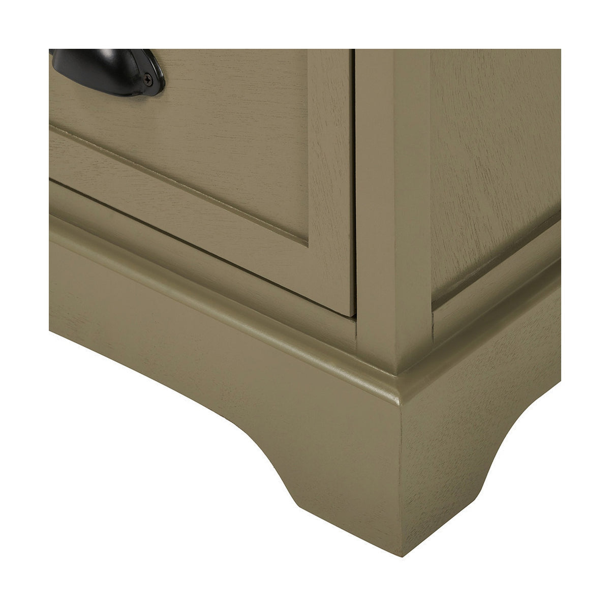 Close-up of the Croft Olive Pine 3 Drawer Unit corner, showing a shaker-style door panel, black cup handle, moulded plinth base, and shaped bracket foot in an olive green wood finish.