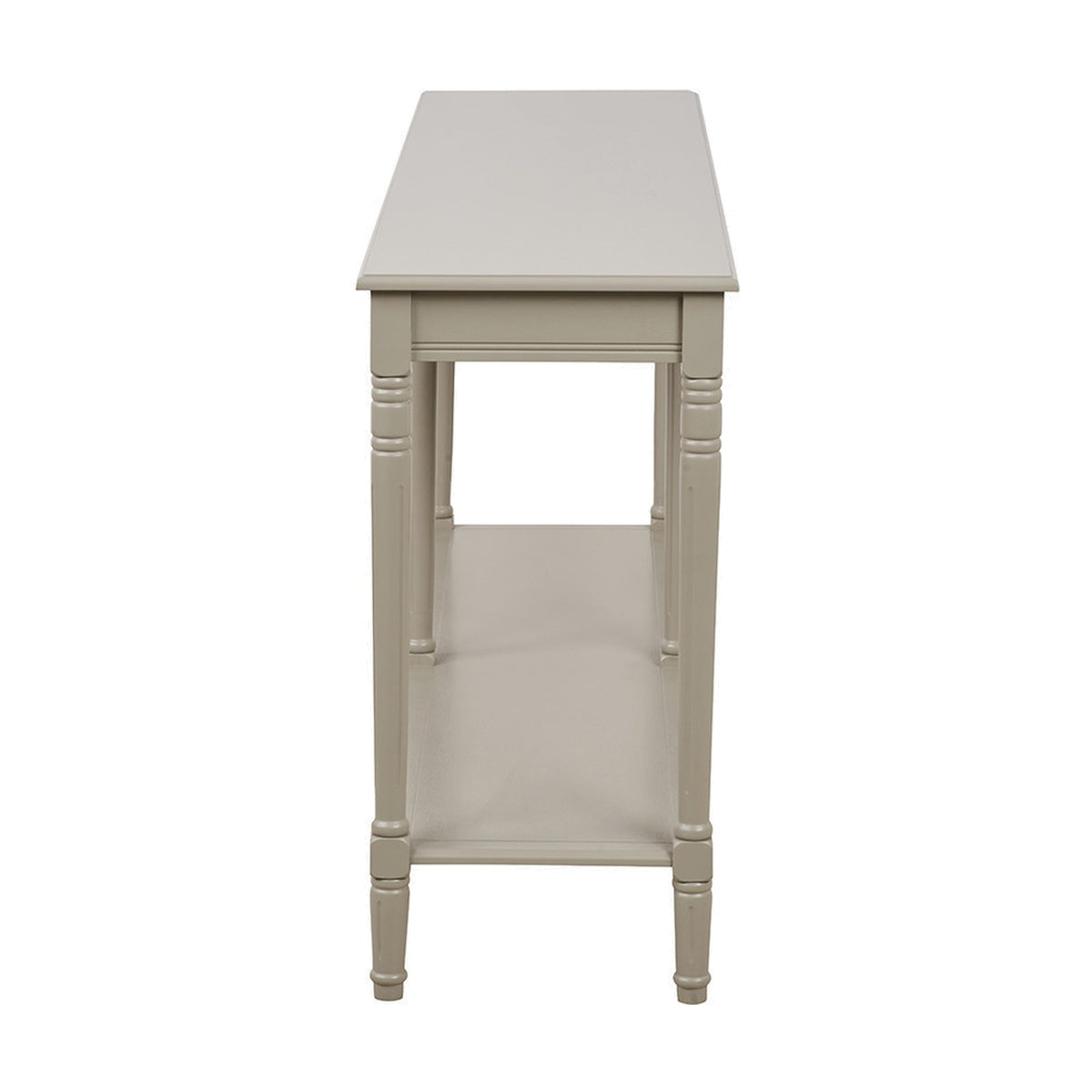 Heritage Putty Pine Large Console Table in cream wood, side view showing turned legs, lower shelf, and slim tabletop overhang on a plain white background.