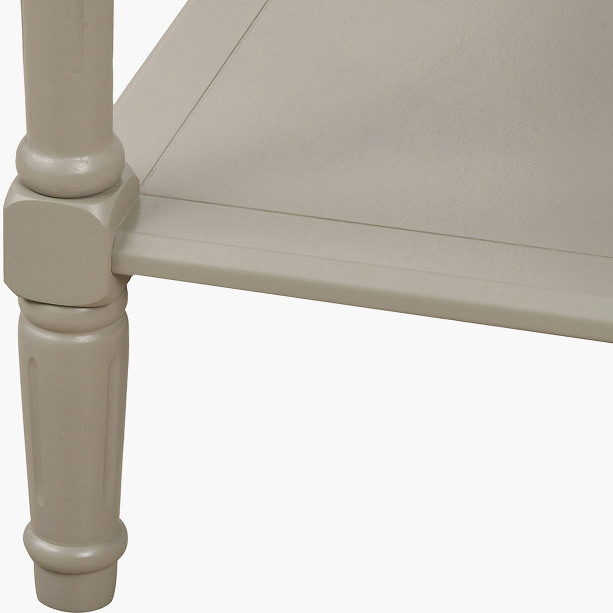 Close-up of the Heritage Putty Pine Large Console Table's turned wooden leg and shelf joint, showing a cream painted finish with carved detailing.