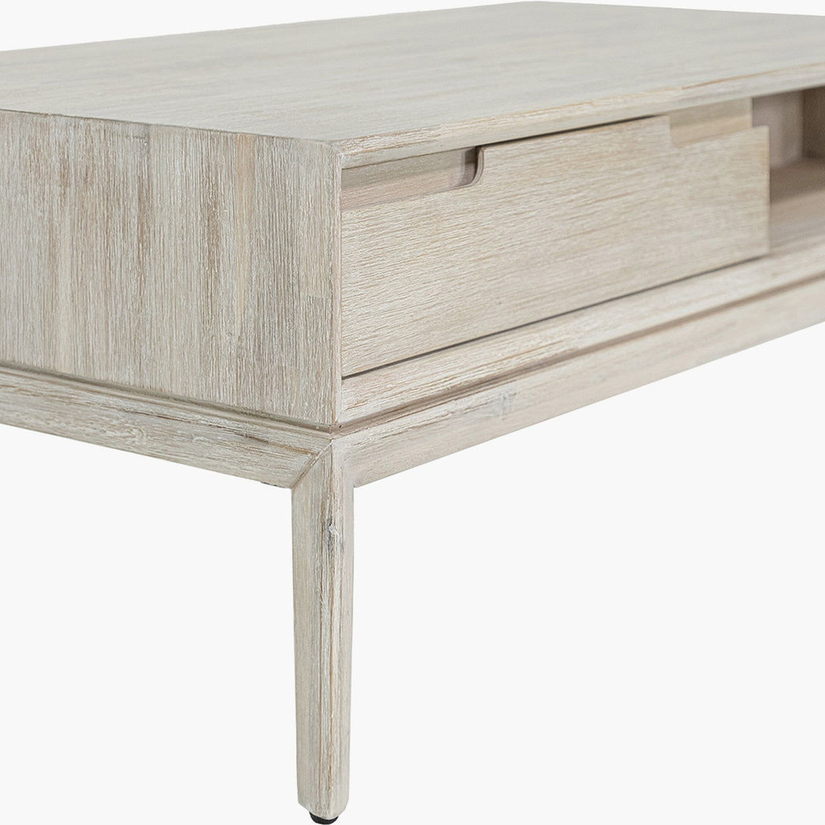 Close-up of the Gio White Sand Acacia 2 Drawer Coffee Table, showing whitewashed wood grain, a recessed cut-out drawer handle, and a tapered leg on a plain background.