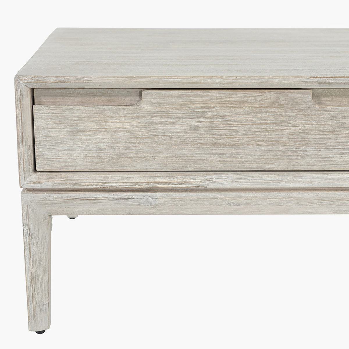 Close-up of the Gio White Sand Acacia 2 Drawer Coffee Table corner, showing wood-grain finish, drawer front, and tapered leg on a white background.