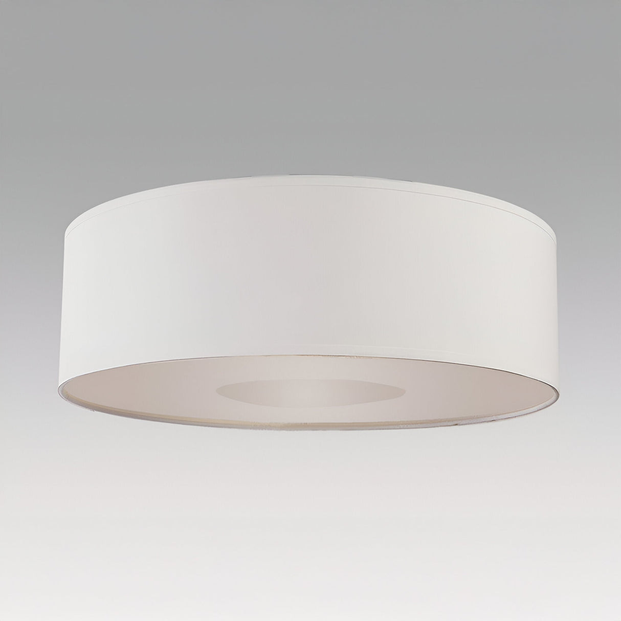Schuller Domo 55cm ceiling lamp shade in white fabric with translucent lower diffuser, shown in a low-profile drum form on a plain grey background.
