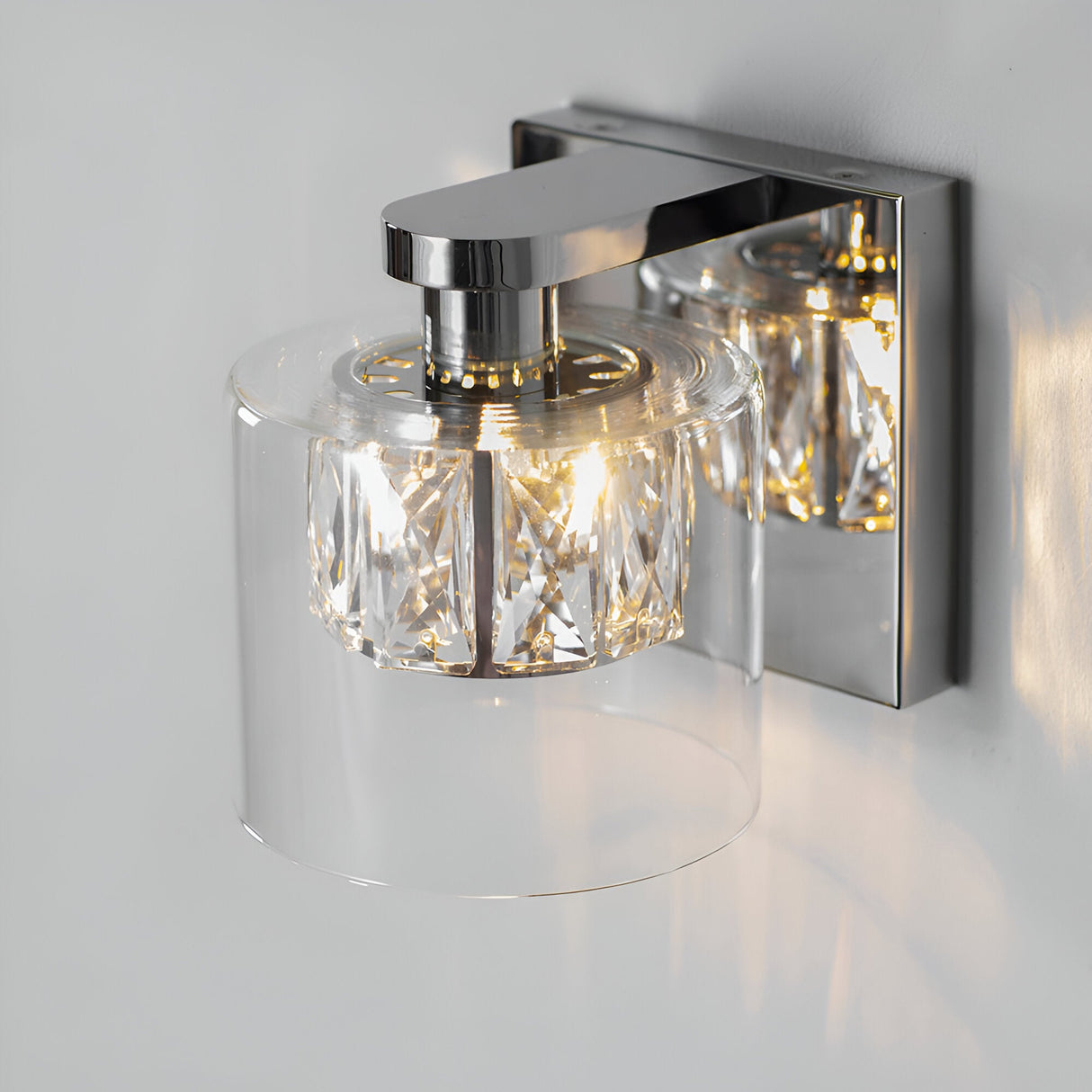Endon Marguerite chrome wall light with faceted crystal shade inside a clear glass diffuser, mounted on a square polished chrome backplate.