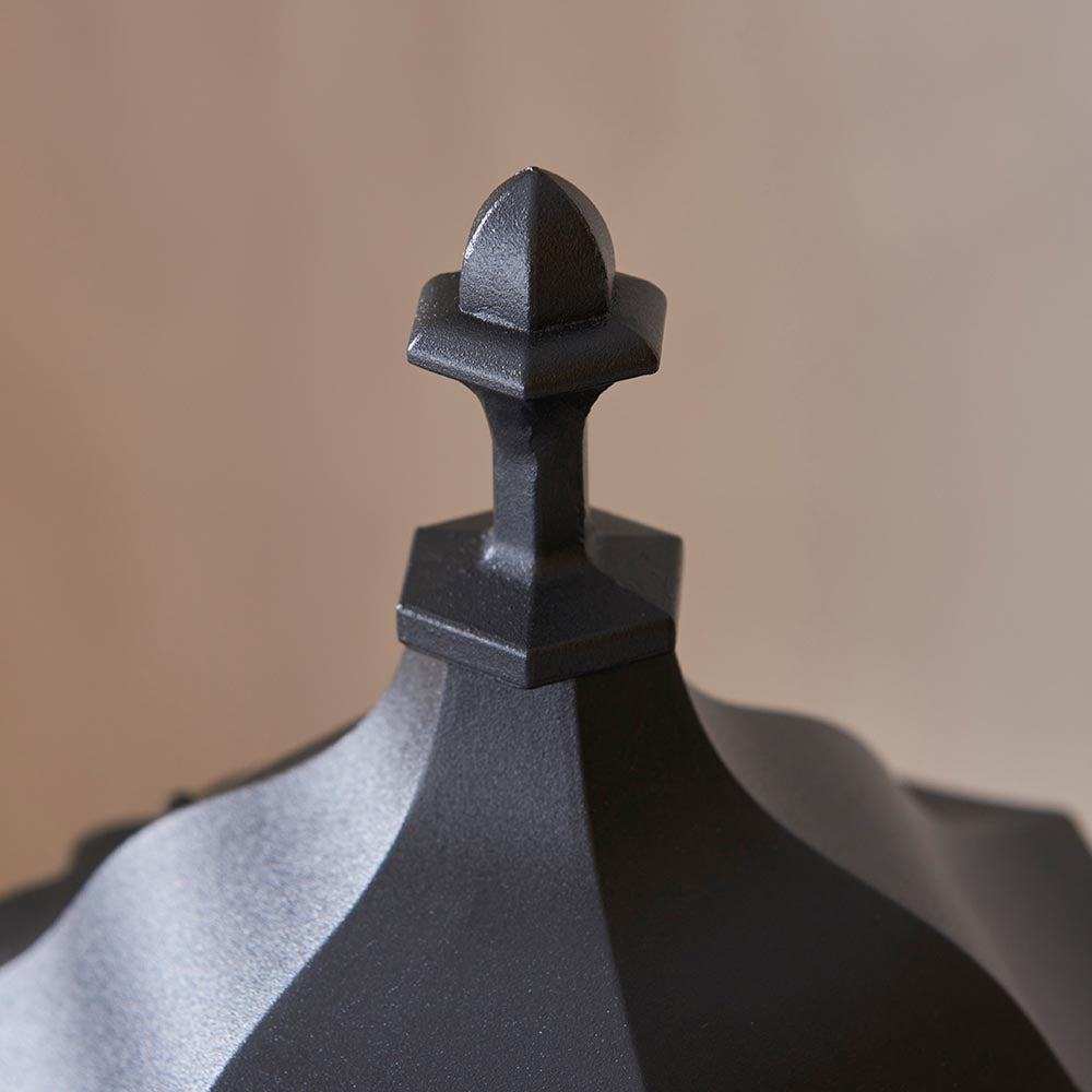 Close-up of the finial on Endon Ashshaw Bollard Light in matt black die cast aluminium, showing the pointed cap and hexagonal base detail.