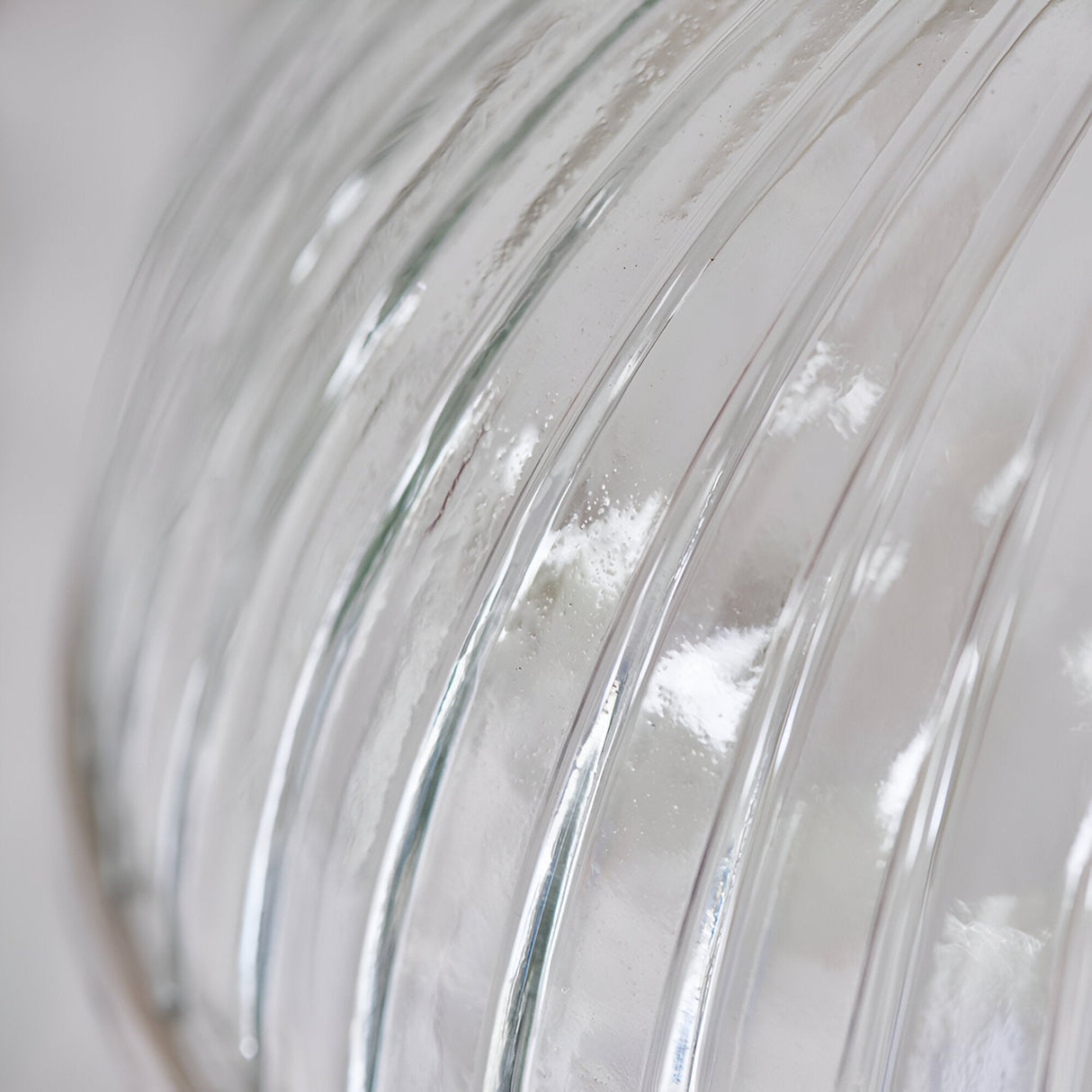 Close-up of the Wentworth Pendant Light's ribbed clear glass shade with nickel metal rim, showing vertical fluted texture and industrial-style detailing.