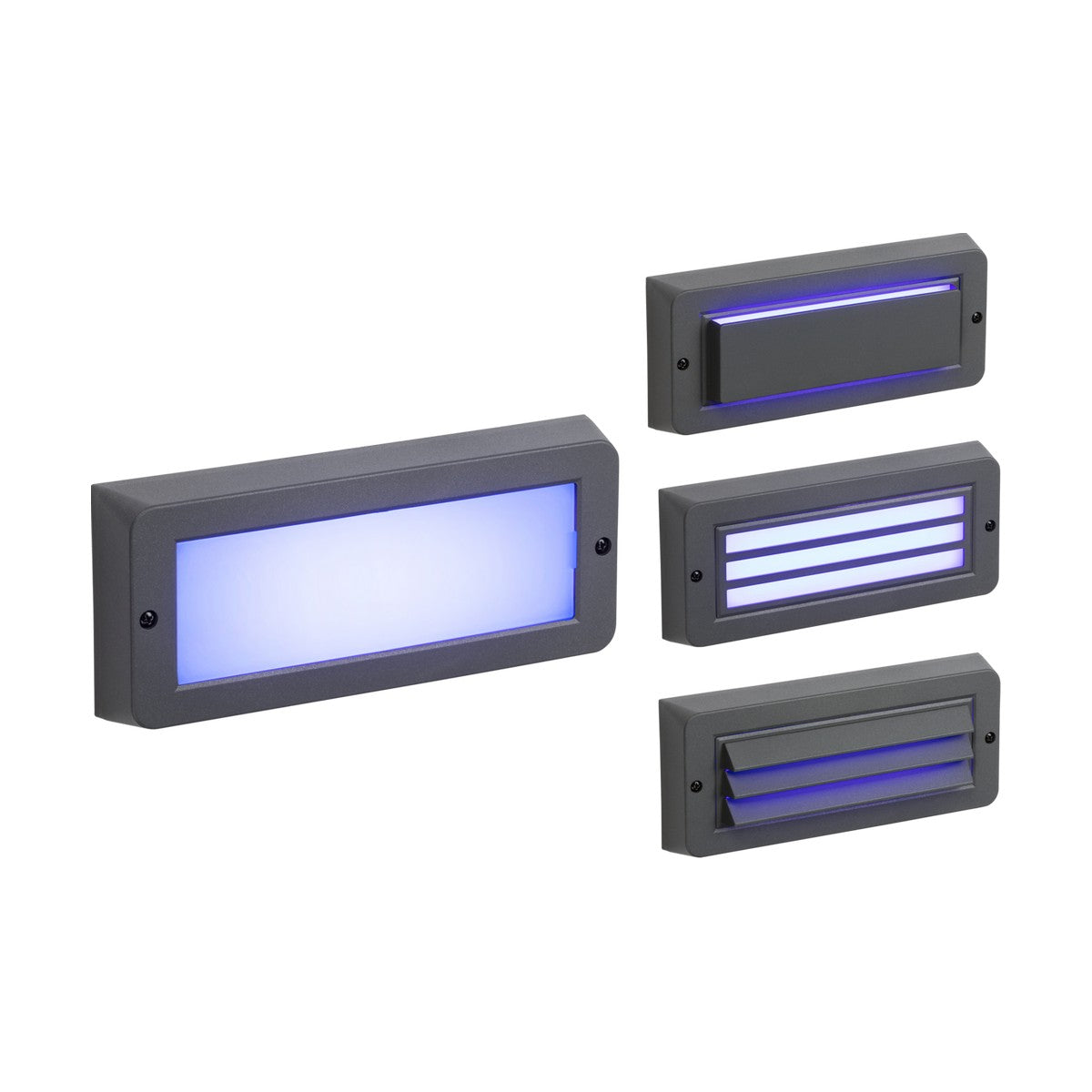 Discover the Outdoor Blue LED Surface Mount Brick Light - Grey, a set of four rectangular lights perfect for outdoor settings. Each light emits a soft blue glow and features durable polycarbonate construction with options for solid or slotted covers, all encased in sleek dark gray frames that exude bricklight elegance.