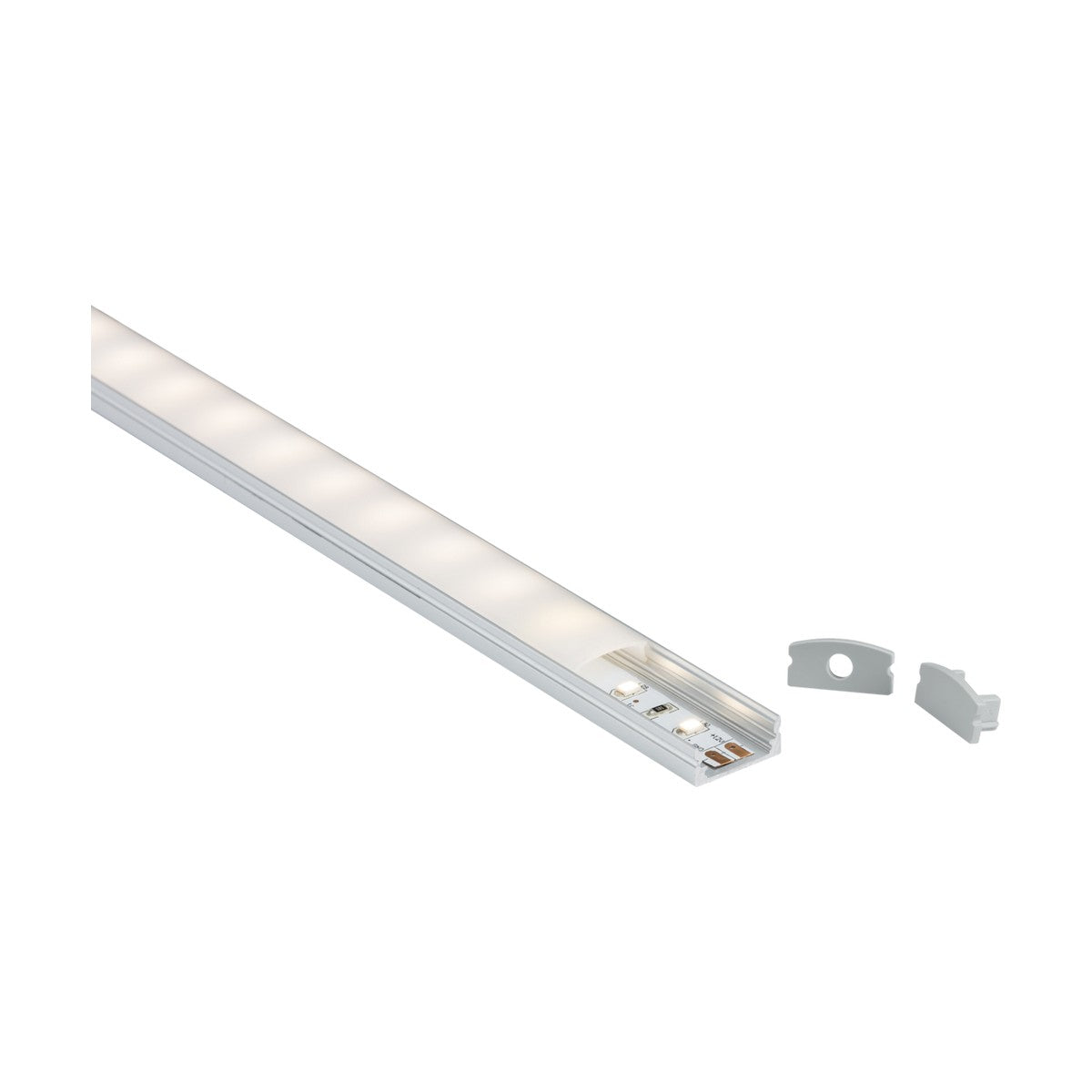 The Aluminium LED Profile 2m - Surface Mount, featuring a white plastic casing with an optional aluminum profile, extends diagonally across the image. Two detachable end caps accompany the strip, and it emits a soft glow that highlights its sectional design. Mounting clips are included to ensure easy installation.