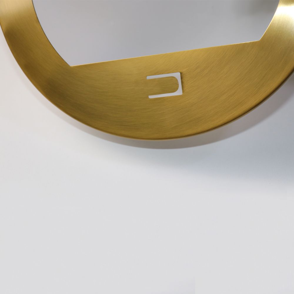 A close-up of the Arc Pendant Light in gold and white on an unblemished background highlights its contemporary design. The minimalist, sleek aesthetic with gently rounded edges and a small rectangular cutout adds elegance to any space, perfectly complementing brushed brass fixtures in a stylish setting.