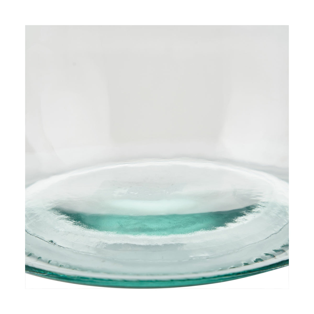 Close-up of the clear recycled glass vase's wide base, showing subtle green tint and textured glass against a plain white background.