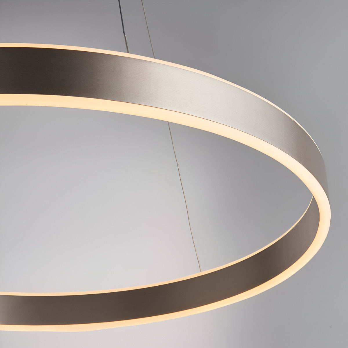 Bramford Pendant in matt nickel, a large oval LED ring fixture with a frosted diffuser edge, suspended on thin cables against a plain grey background.