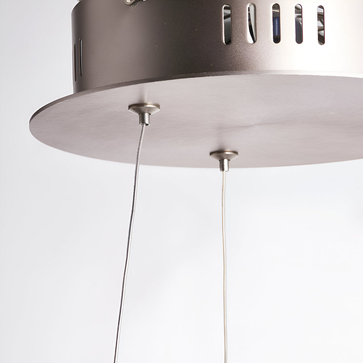 Close-up of the Bramford Pendant in matt nickel, showing a round ceiling canopy with twin suspension cables leading to a slotted cylindrical fitting.