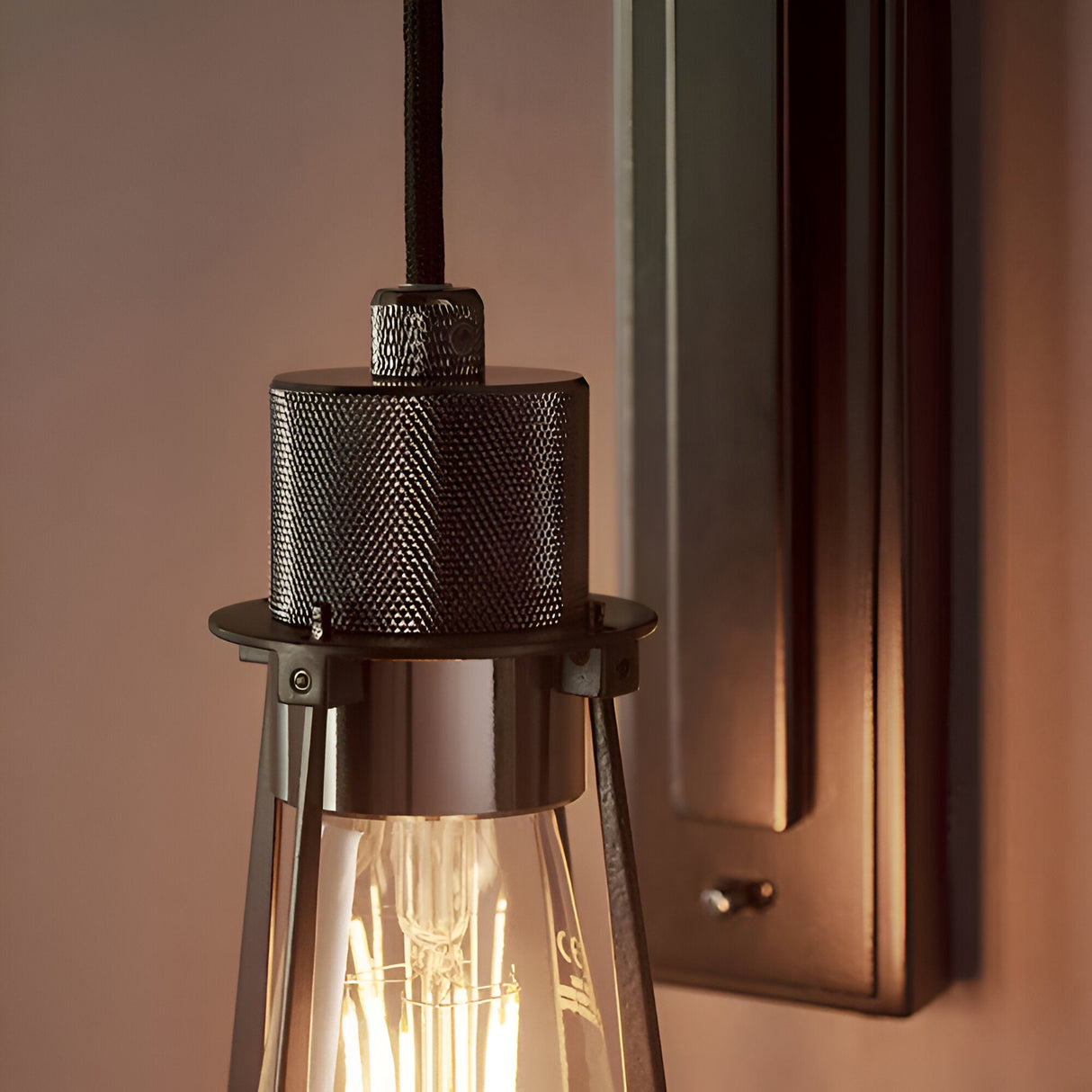Endon Camden industrial wall light with braided cable, black chrome knurled fitting and tapered smoked glass shade over an exposed filament E27 bulb.