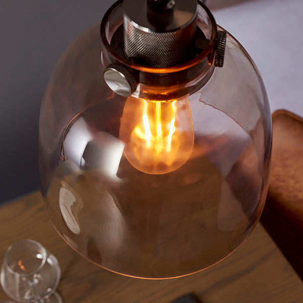 Camden Pendant Light in chrome and black with a smoked glass dome shade, exposed E27 filament bulb, and knurled adjustable fitting.