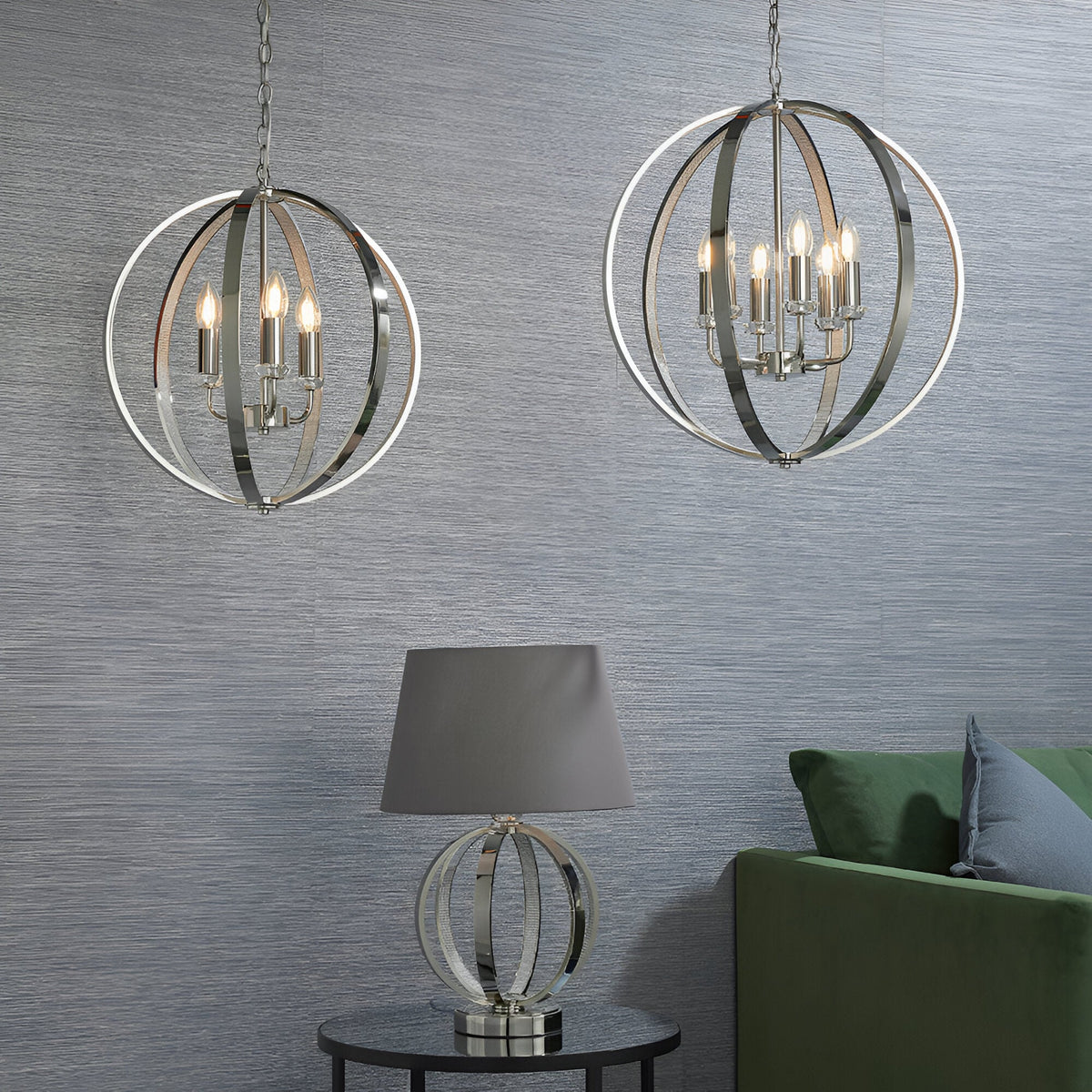 Cliffbury 6 Light Pendant in polished nickel, spherical open-frame design with lit candle bulbs, shown alongside a matching table lamp in a living room setting.