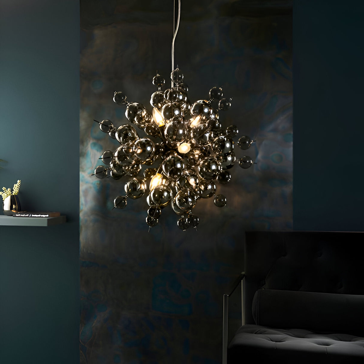 Brockford 9 Light Cluster Pendant in black, clustered smoked glass spheres on metal fittings, glowing above a dark, moody living room setting.