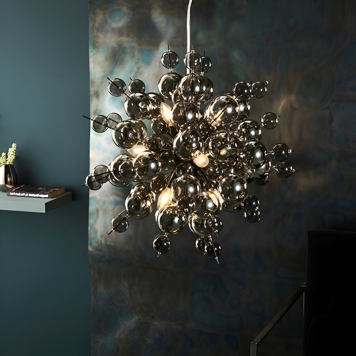 Brockford 9 Light Cluster Pendant in black, smoked glass spheres on black metal fittings, shown hanging in a moody dining room setting.