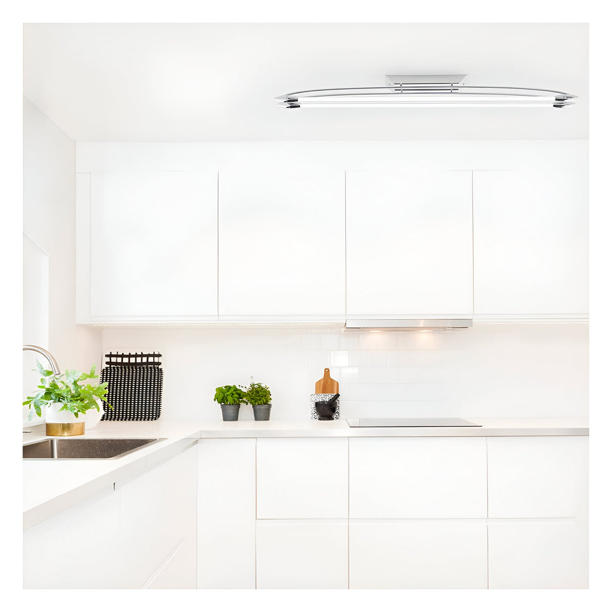 Brencombe 2 Light Medium Linear Ceiling Light in polished chrome and white, mounted on a white kitchen ceiling above light cabinetry.
