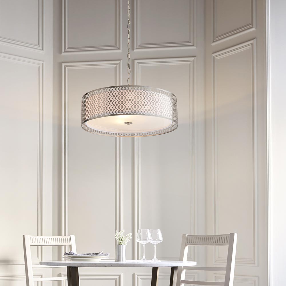 Endon Rosaline 3 Light Pendant in nickel with circular geometric fretwork outer, white fabric inner shade and frosted glass diffuser, above a dining table.