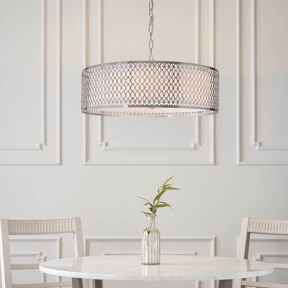 Endon Rosaline 3 light pendant in satin nickel with circular geometric fretwork outer and white fabric inner, hanging above a marble dining table.