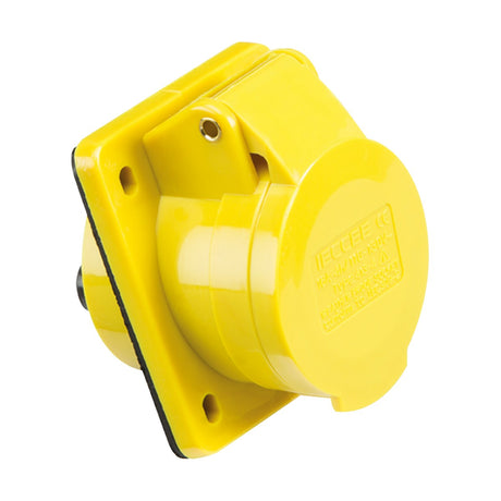 The 16A 2 Pole Earth Angled Panel Mount Socket - Yellow features an IP44 rated industrial yellow outlet with a protective hinged cover, on a square base. Its secured by four screws and has raised lettering for technical specifications.