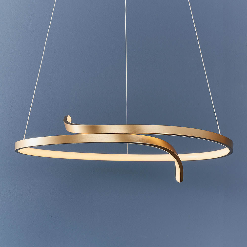 Endon Chartmont pendant light in matt brushed gold, a slim curled ring with integrated LED and frosted diffuser, suspended against a blue wall.