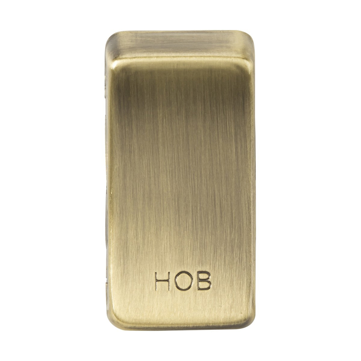 A rectangular object in antique brass metal, featuring rounded edges and engraved with the text "HOB," evokes the classic appearance of a rocker cover. This is the Switch Cover "Marked HOB" - Antique Brass.