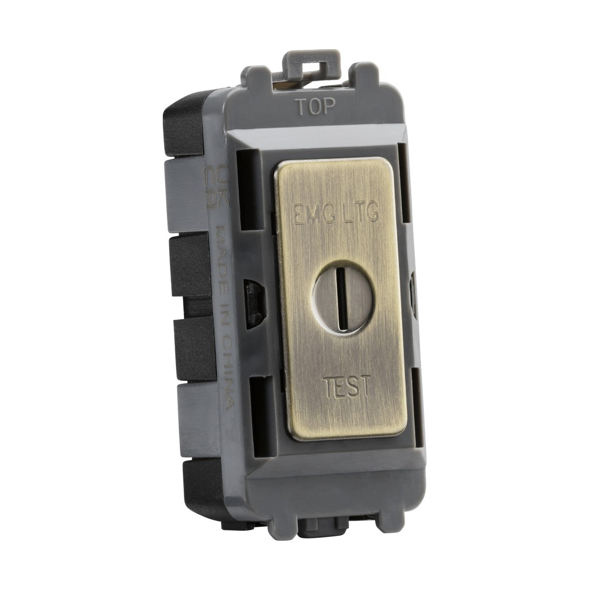 An Antique Brass 20AX 2 Way SP Key Module, marked with EMG LTG and TEST, includes a central toggle switch and features a faceplate designed for the Knightsbridge Grid System. It has a black plastic housing and is engraved with "TOP" on the top edge to guide correct installation orientation.