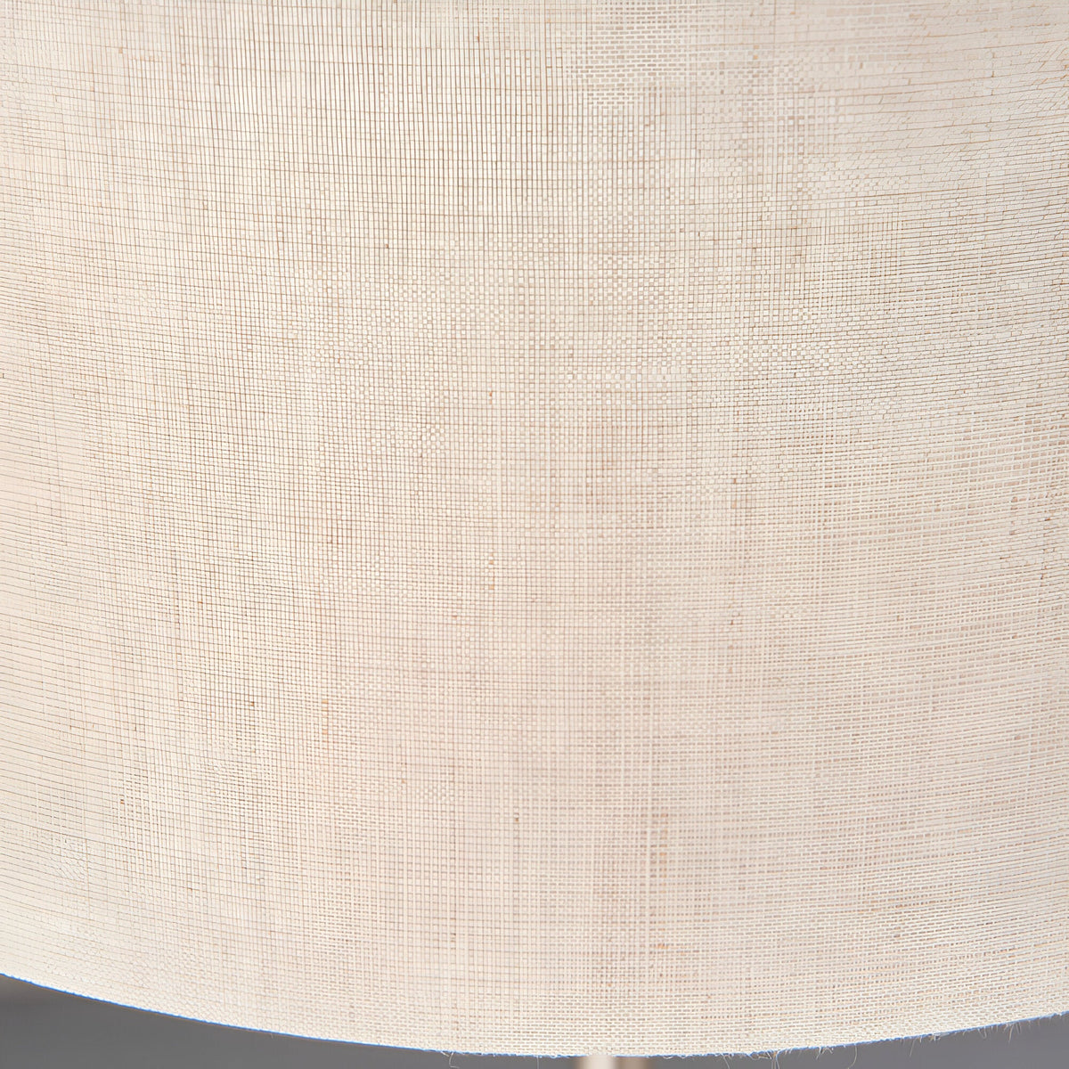 Close-up of the Endon Brenley table lamp's natural linen shade, showing its woven texture in a soft neutral tone.